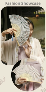 Detail of a vintage Chinese folding fan with cherry blossom print and a silk tassel pendant