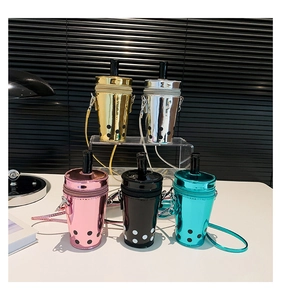 Detailed view of bubble tea cup-shaped bucket bags in various metallic patent colors