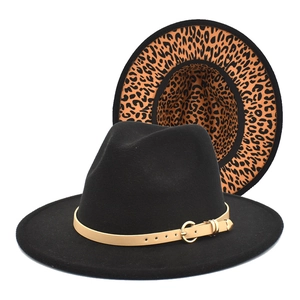 Detail of black wool fedora featuring leopard print underbrim and leather buckle band