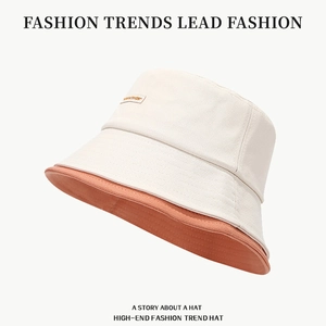 Cappello a secchiello minimalista bicolore crema e rosa corallo anti-sole