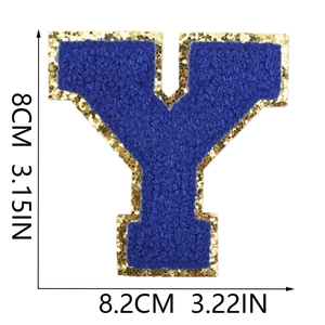 Close-up of royal blue letter Y towel embroidery patch with gold glitter sequins
