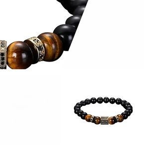 Macro detail of men's tiger eye and black bead bracelet with gold micro-pave hex beads