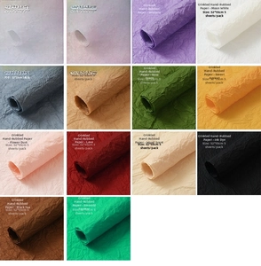 Detailed view of 14 color options for textured wrapping paper in a professional grid layout