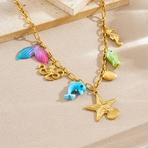 Golden ocean theme necklace with acrylic mermaid tail, starfish, and octopus pendants