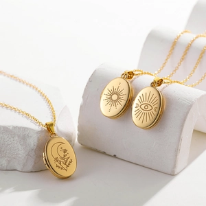 Gold stainless steel oval locket necklaces with sun moon and evil eye engravings
