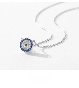 Macro shot of S925 sterling silver evil eye necklace with vibrant crystal micro-pave setting