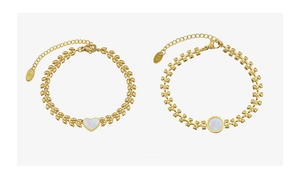 Detail of 18K gold-plated wheat chain bracelet with white shell heart and round charms