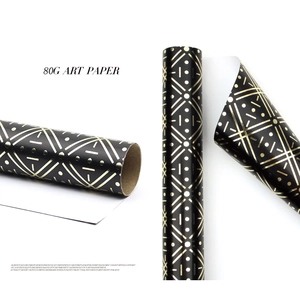 Detail of 80g black and gold art wrapping paper with elegant geometric patterns