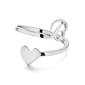 Detail of adjustable silver ring featuring a stylized letter B and heart design