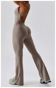 Detail of cross-back flare jumpsuit showing ergonomic fit and high-stretch fabric