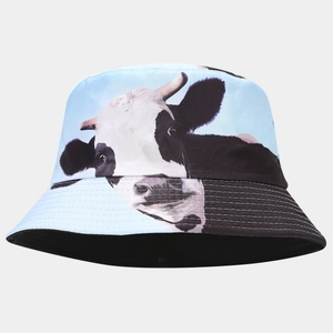 Detail of blue bucket hat with cow print and black brim with white stitching