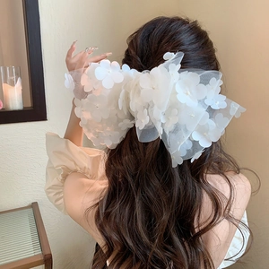 Elegant white mesh bow hair clip with 3D floral petals for women's spring hair styling