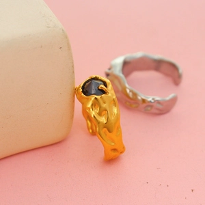 Minimalist Y2K gold plated titanium ring with black gemstone and lava texture design
