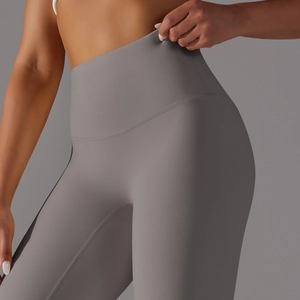 Detailed view of high-waisted gray yoga leggings with seamless stitching and squat-proof fabric