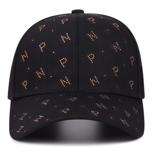 Classic black baseball cap with golden metal rivets and embossed star pattern details