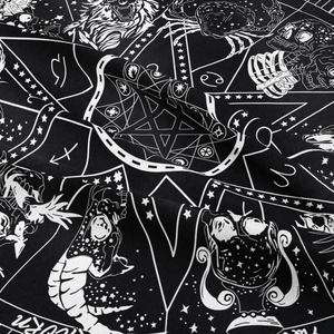 Detailed macro view of Gothic black tapestry with white zodiac and astrology symbols