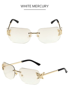 Detail of rimless butterfly sunglasses with gold temples and sparkling rhinestone accents