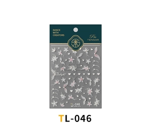 Detail of 5D embossed white flower nail stickers with heart patterns on packaging