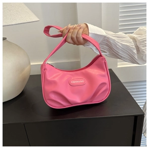 Close-up of pink pleated PU leather crescent bag with Fashion & Bag detail