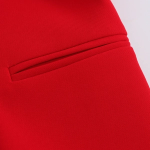 Women's V-neck sleeveless red vest with a detailed welt pocket and premium woven fabric