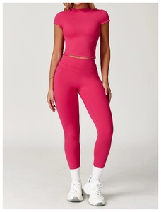 Detail view of the high-stretch brushed fabric on this rose red yoga crop top and leggings