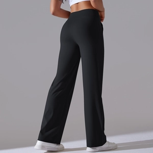 Detail view showing high-waisted wide-leg yoga pants with premium brushed elastic fabric