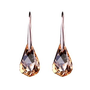 Sparkling amber crystal teardrop earrings with elegant metal hooks on white background