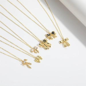 Chic Hawaiian gold bow necklaces set with sparkling zircons and minimalist textures