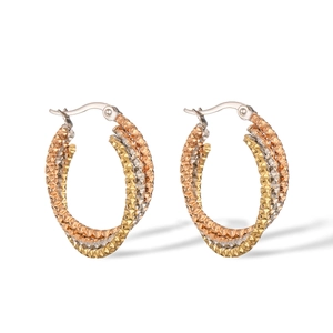 Detailed view of 18K gold plated titanium steel braided hoop earrings in three-tone finish
