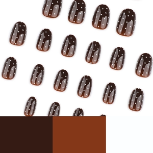 Short round press-on nails in brown gloss finish with classic white polka dot patterns
