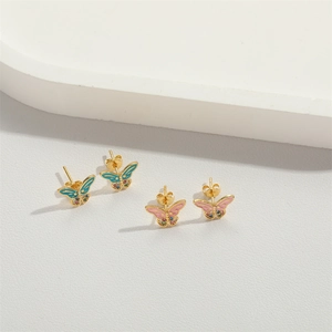 Elegant gold butterfly stud earrings with colorful enamel and gemstones on white background