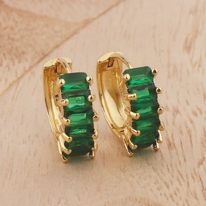 Elegant gold earrings with square green gemstones in a minimalist huggie style design