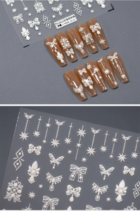 Detail of 5D baroque pearl nail stickers with white embossed bow and star patterns