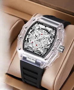 Detail of tonneau-shaped transparent watch with white skeleton movement and silicone strap