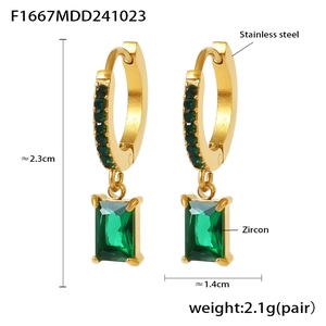 Macro shot of 18K gold plated stainless steel earrings with green square zircon charms
