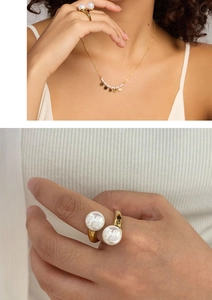 Detail view of adjustable gold ring with twin pearls and matching dainty necklace set