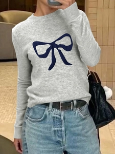 Women's casual grey knit short-sleeve sweater featuring a navy blue bow on the front