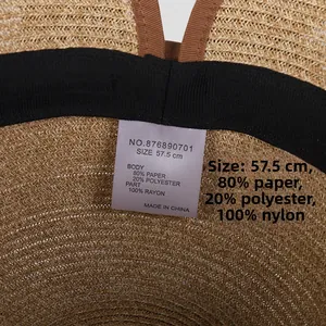 Detail of woven straw hat interior with 57.5cm size label and black sweatband