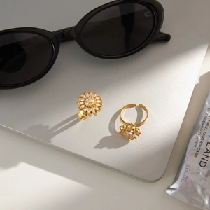 Adjustable gold plated stainless steel spinning flower rings with white zircon stones