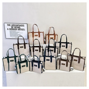 Collection of color-block canvas tote bags in various sizes with leather straps
