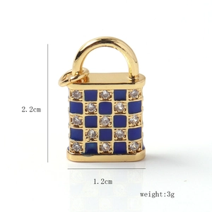 Detailed view of gold plated padlock pendant with blue checkerboard and white zircon