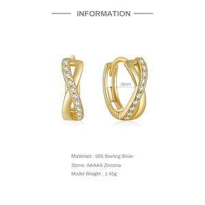 Detail of 925 sterling silver crossover earrings with gold finish and AAAAA zircon stones