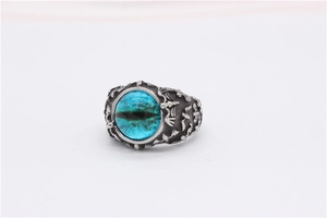 Detailed view of Gothic bat ring with blue gemstone and vintage silver finish