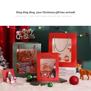 Detail of Christmas gift bags with transparent window showing plush toys inside