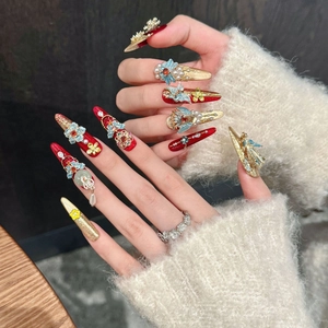 Luxurious Chinese style red and gold fake nails with 3D phoenix and pearl embellishments