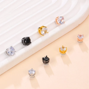 Detailed view of magnetic zircon studs in gold, silver, black, and rose gold finishes