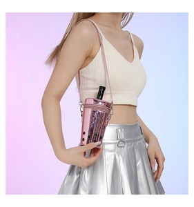 Close-up of metallic pink pearl milk tea cup crossbody bag with laser finish and strap