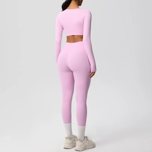 Detail view of the pink yoga set showing back ergonomic cut and high-waist fit