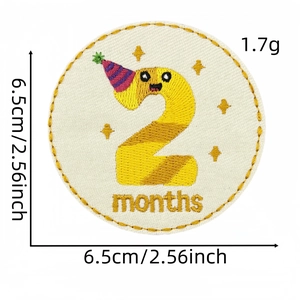 Detail of embroidered milestone patch number 2 with party hat for baby clothes