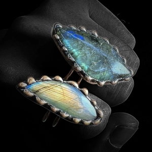 Antique bronze ring featuring oval labradorsite gemstone with blue and yellow flash